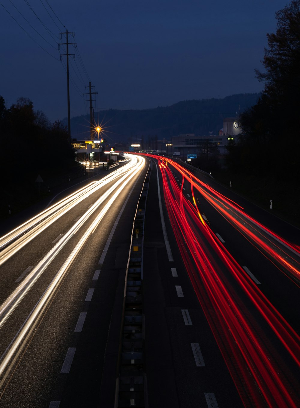 time lapse photography of cars on road during night time