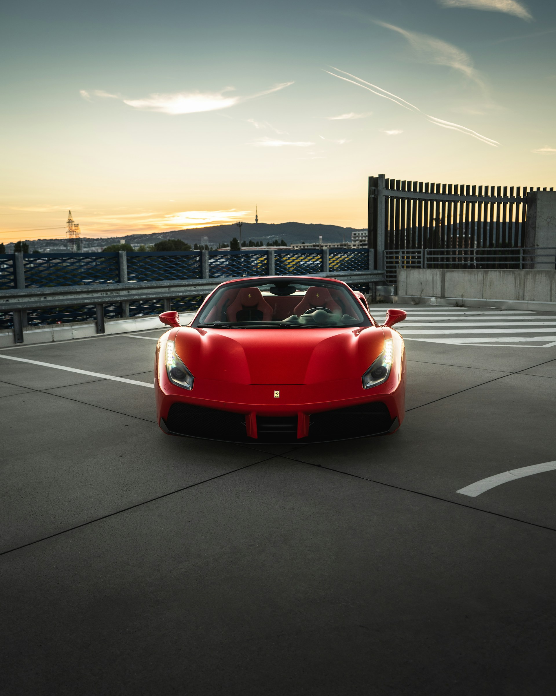 red ferrari sports car on road during daytime
