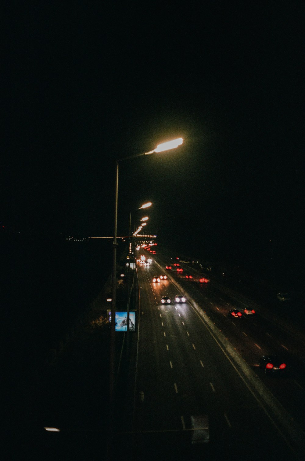 black car on road during night time