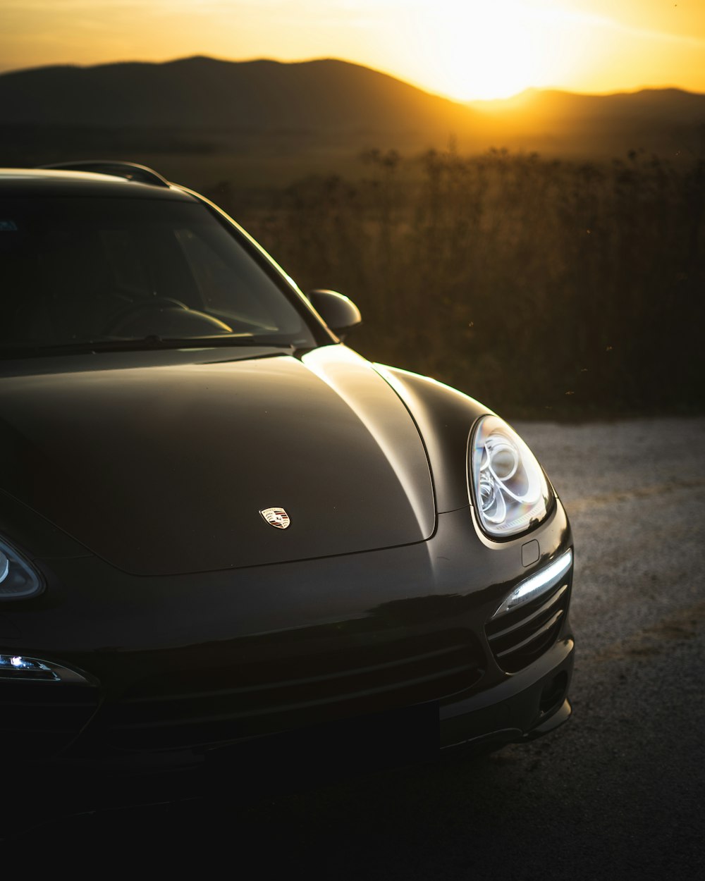 silver mercedes benz coupe on road during sunset