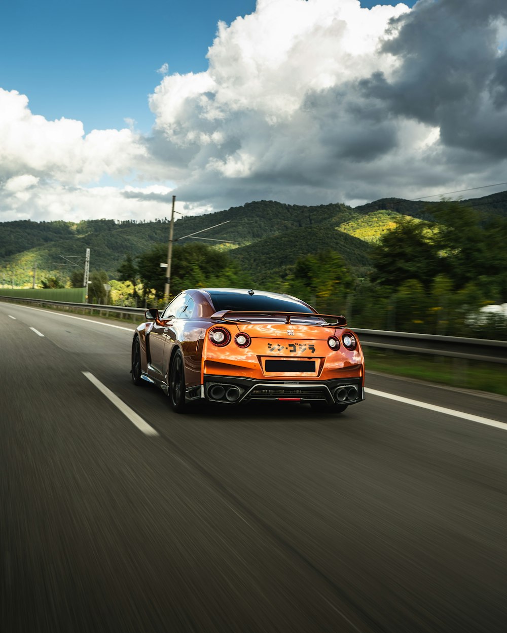 orange and black bmw m 3 on road during daytime