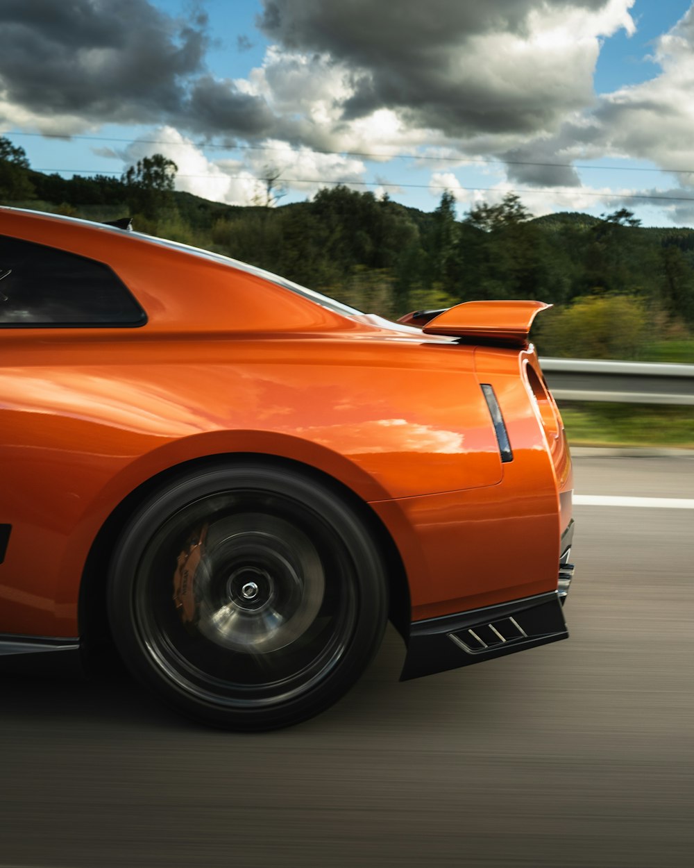 orange ferrari 458 italia on road during daytime