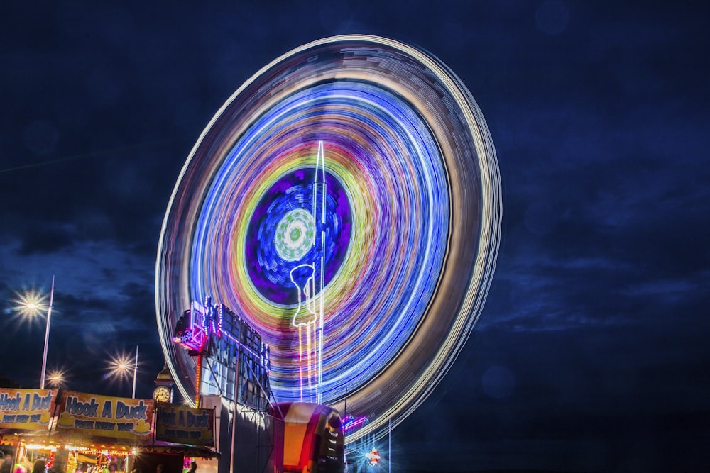 time lapse photography of ferris wheel during night time