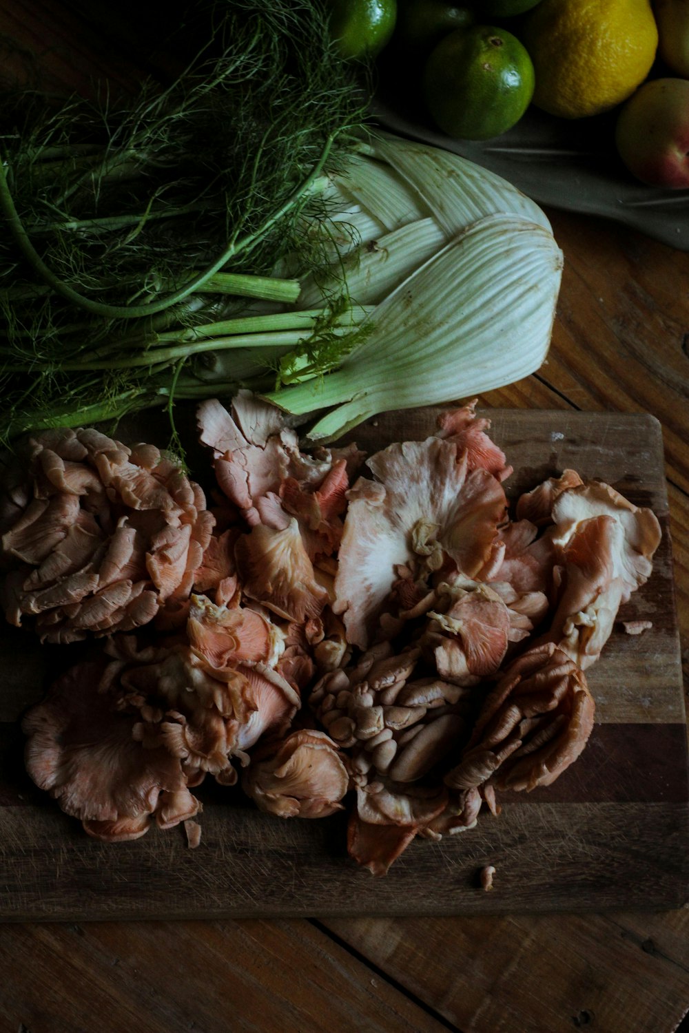 brown and white garlic on brown wooden table