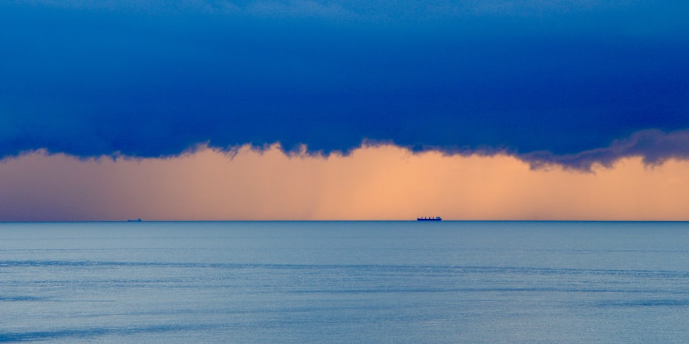 body of water during sunset