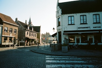 A picturesque view of a Belgian street lined with cafes.