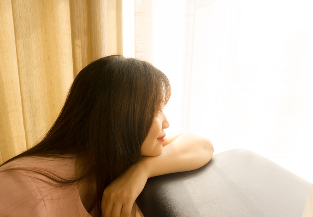 topless woman lying on bed