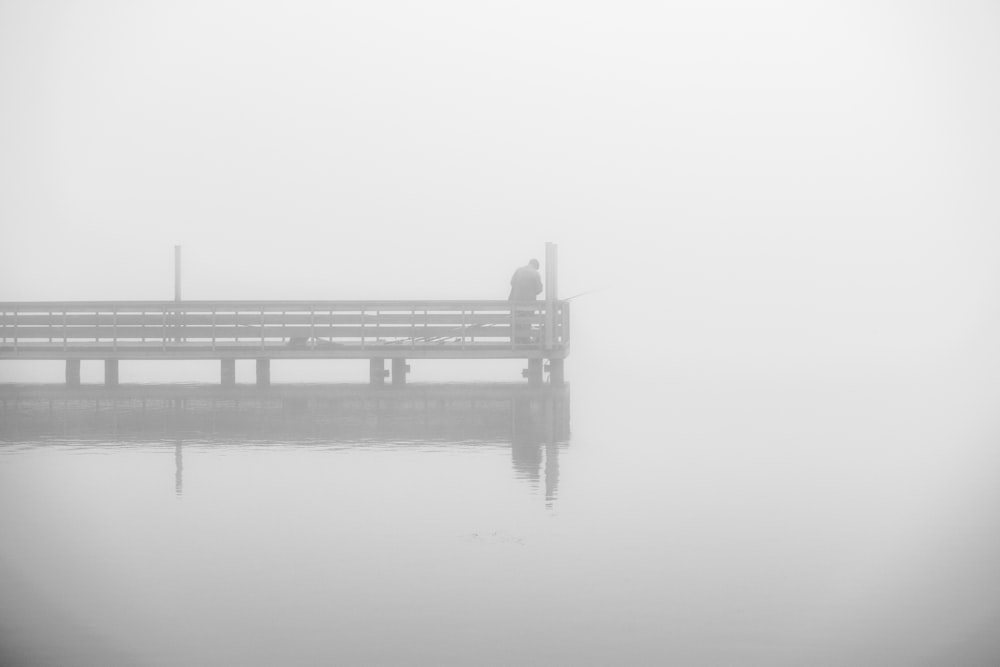 grayscale photo of bridge over water