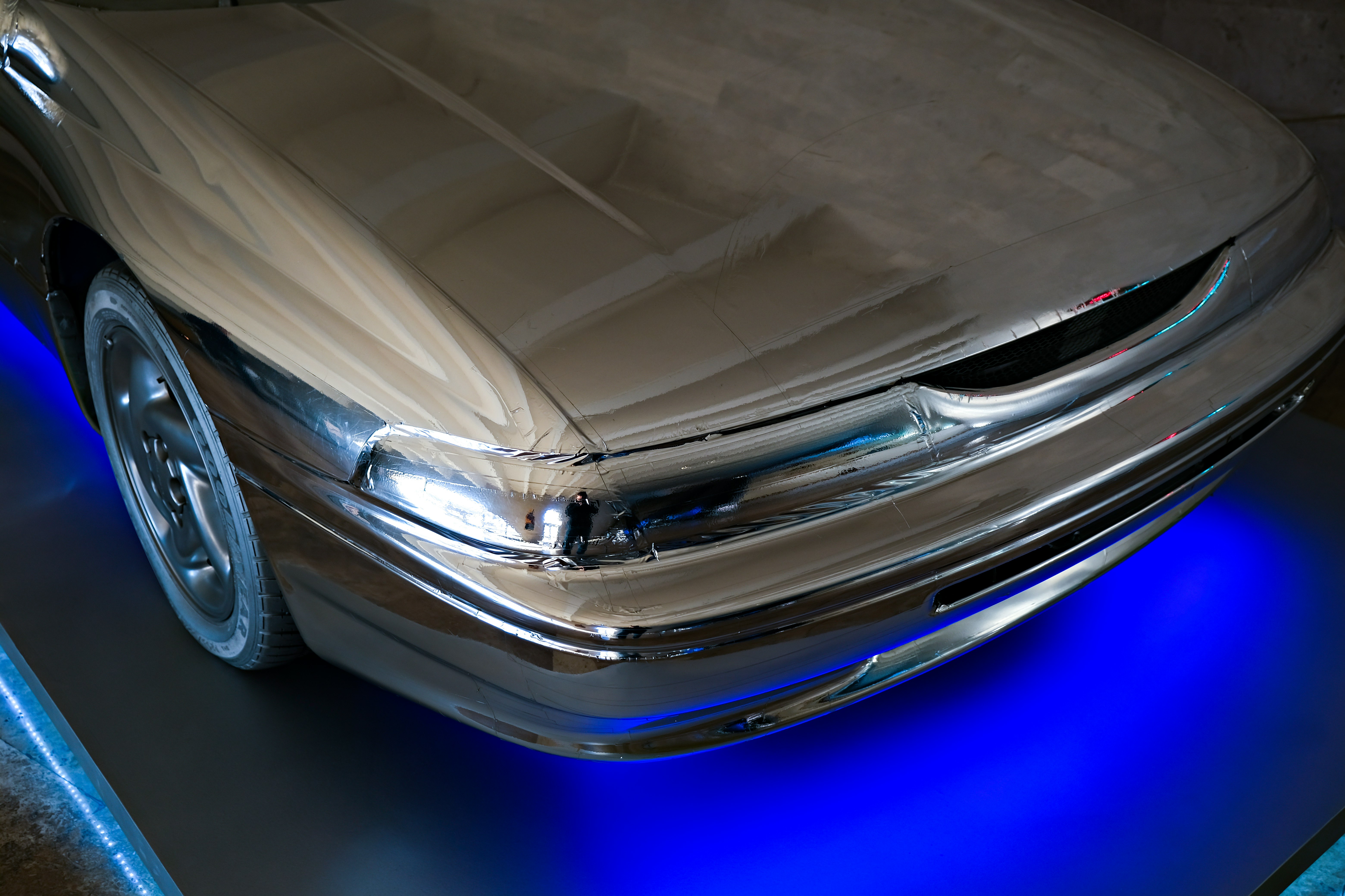silver car on blue floor