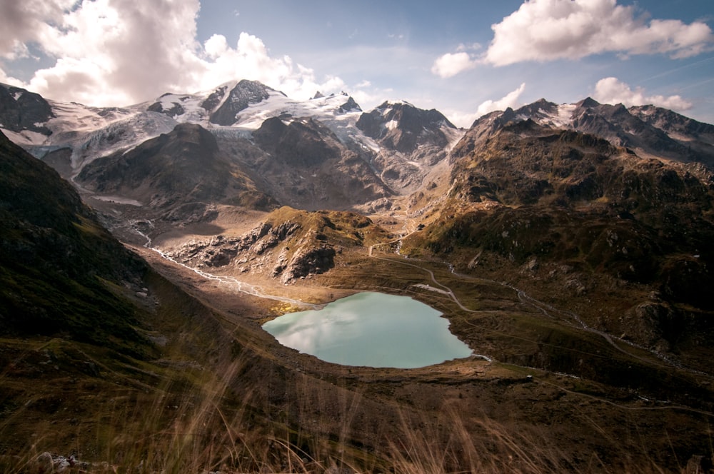 lake in the middle of mountains