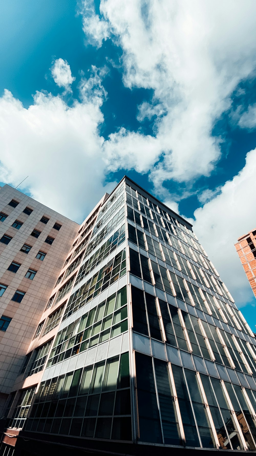 white concrete building under blue sky during daytime