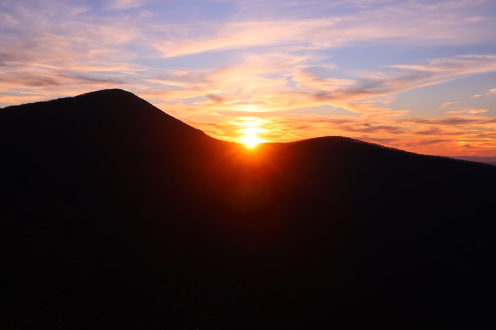 silhouette of mountain during sunset