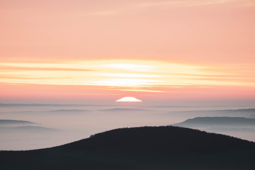 silhouette of mountain during sunset