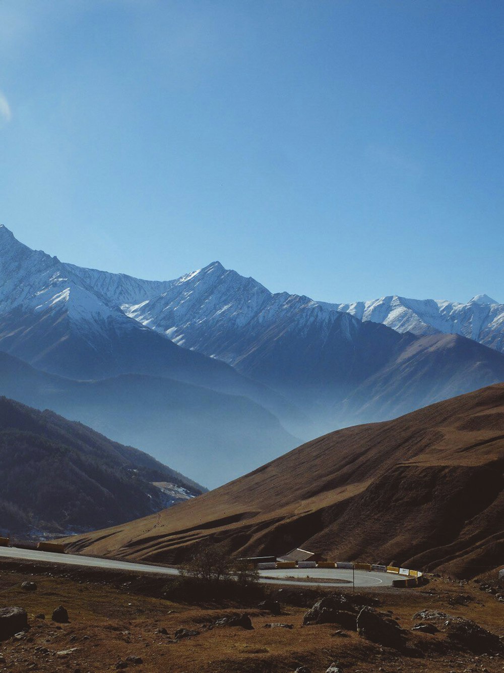 brown and green mountains under blue sky during daytime