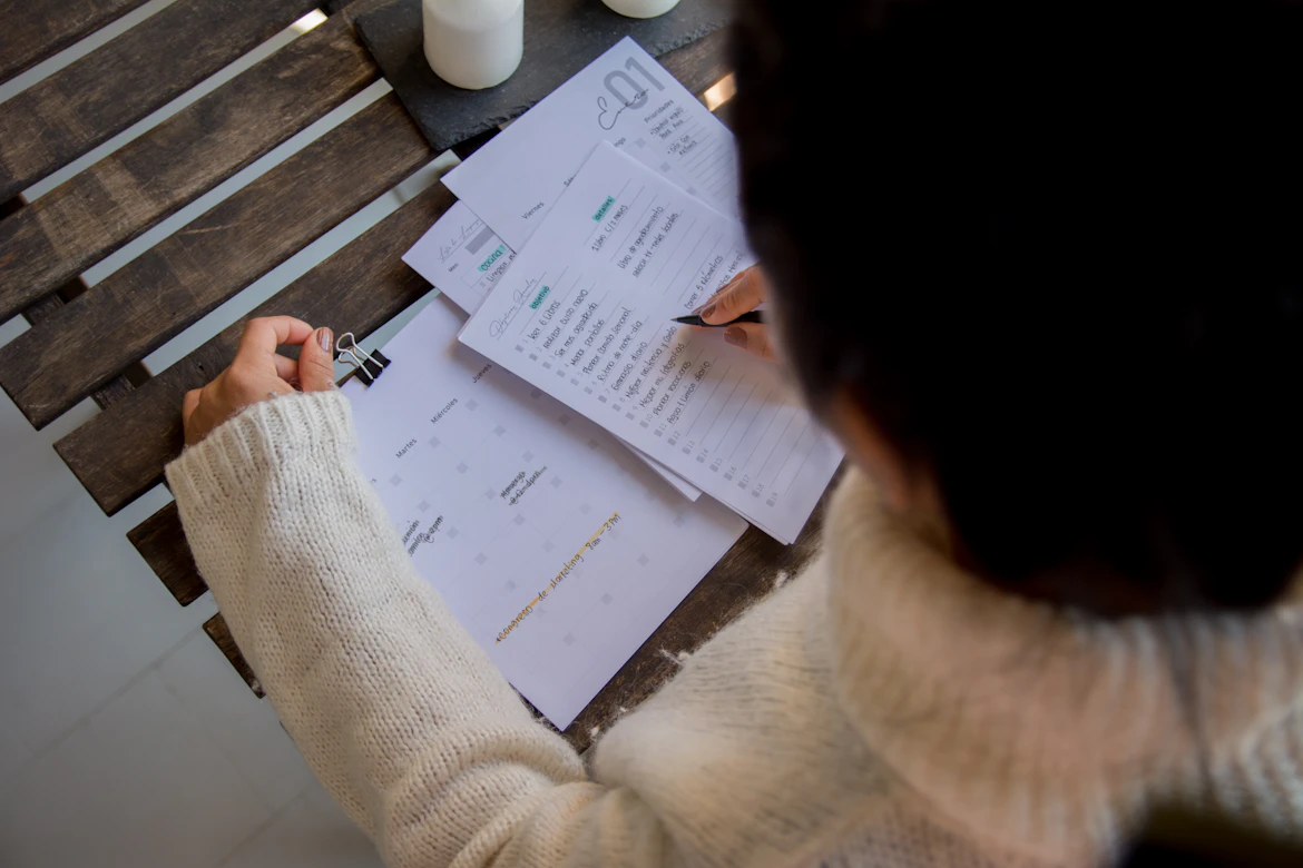 Employee reviewing expense receipts and reimbursement records for tax purposes