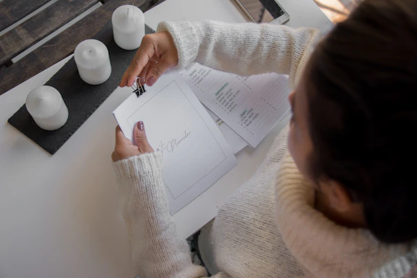 A mobile notary setting up documents at a cozy home office.