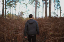A cozy scene of a person wearing a soft, durable jacket while enjoying a peaceful morning walk.