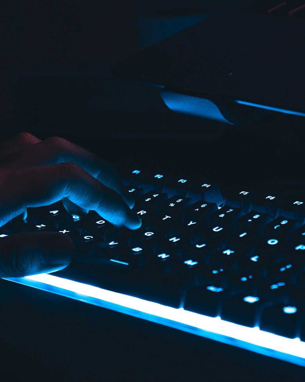 persons hand on black computer keyboard