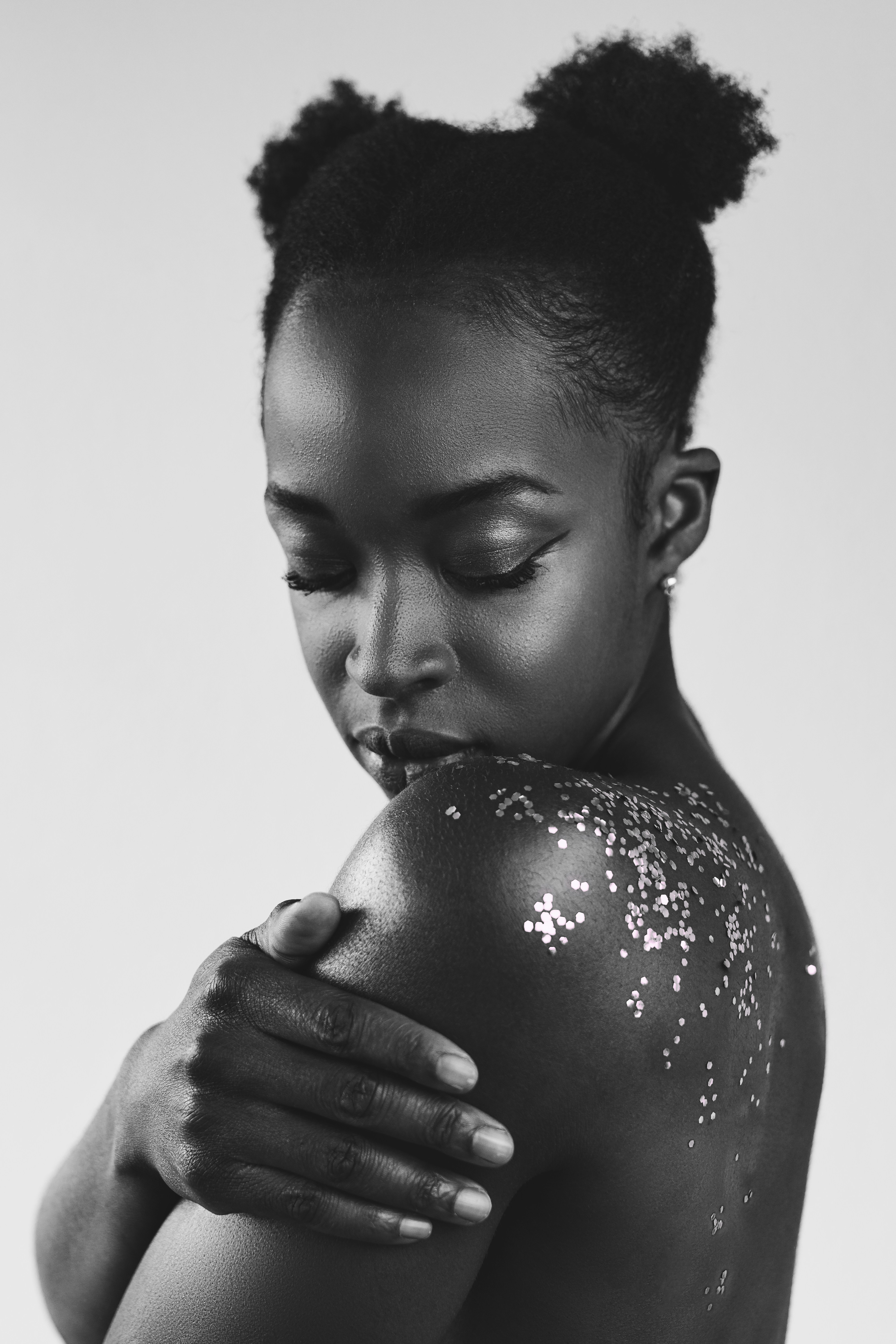 grayscale photo of boy with water drop on his mouth