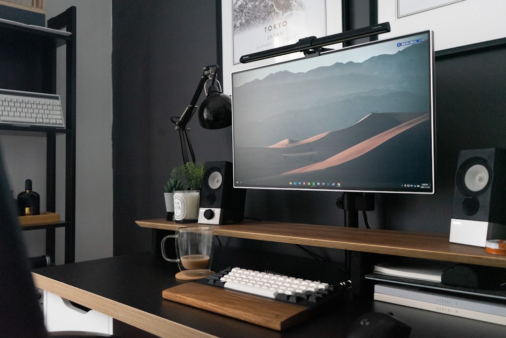 black flat screen tv on brown wooden tv rack