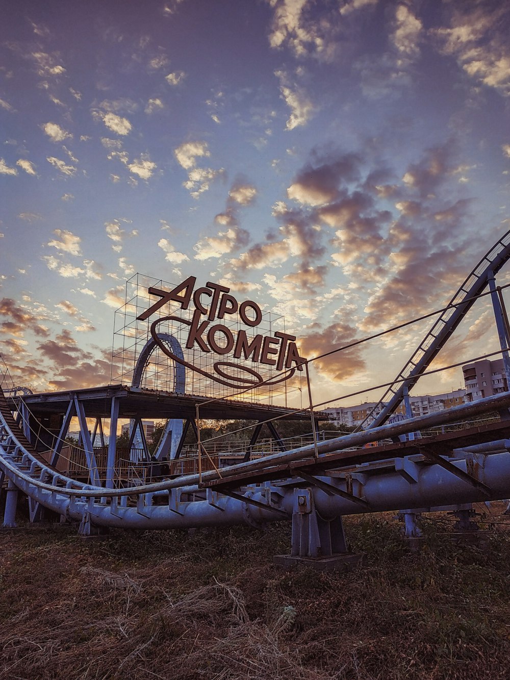 blue and white roller coaster under blue sky during daytime