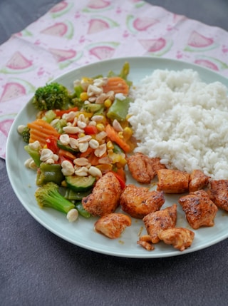 rice with sliced vegetables on green ceramic plate