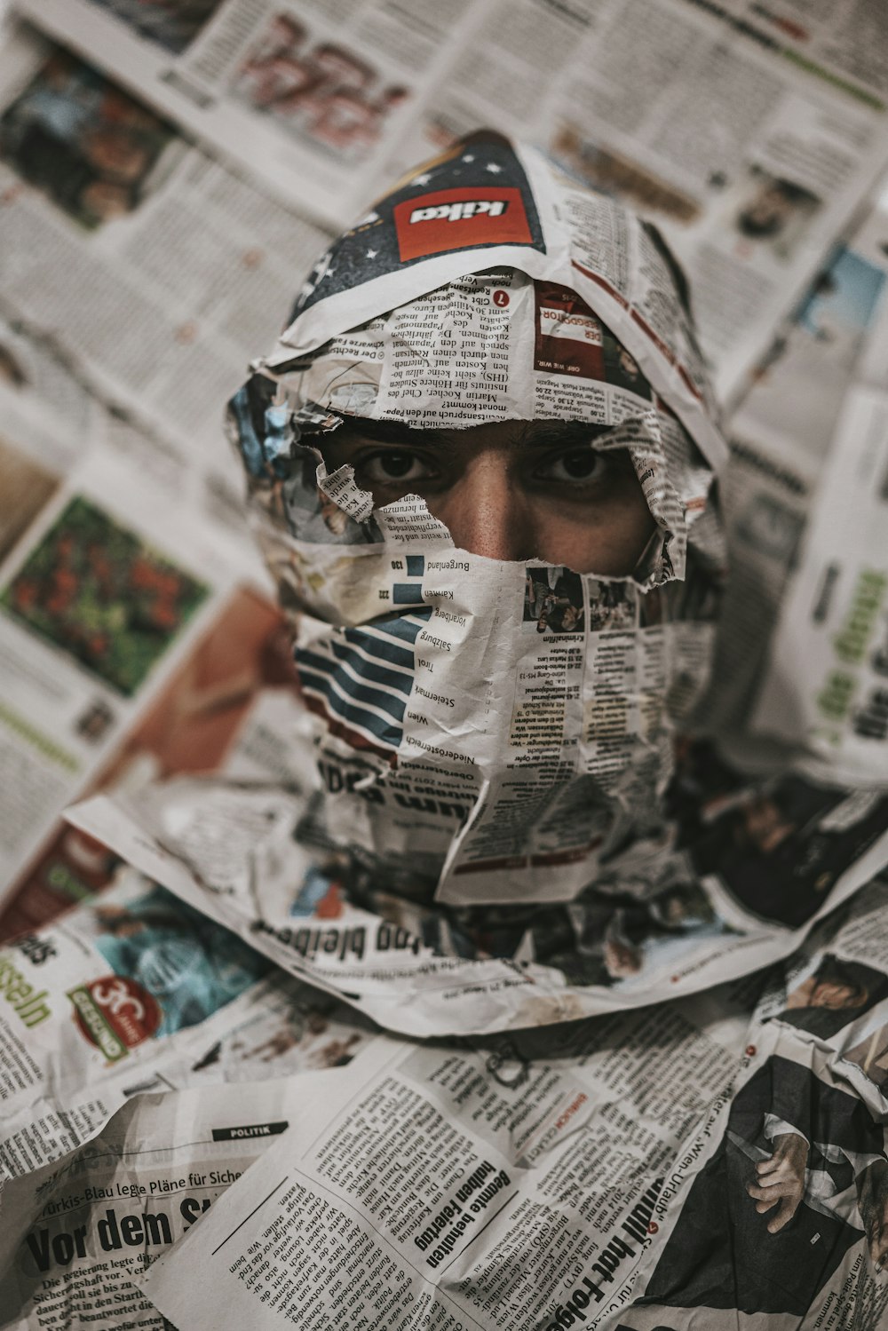 person wearing white red and black mask