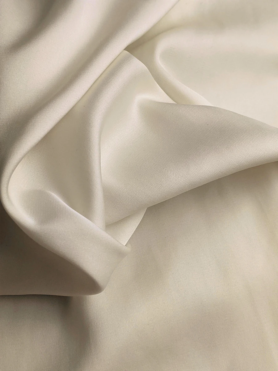 Draped white silk textile