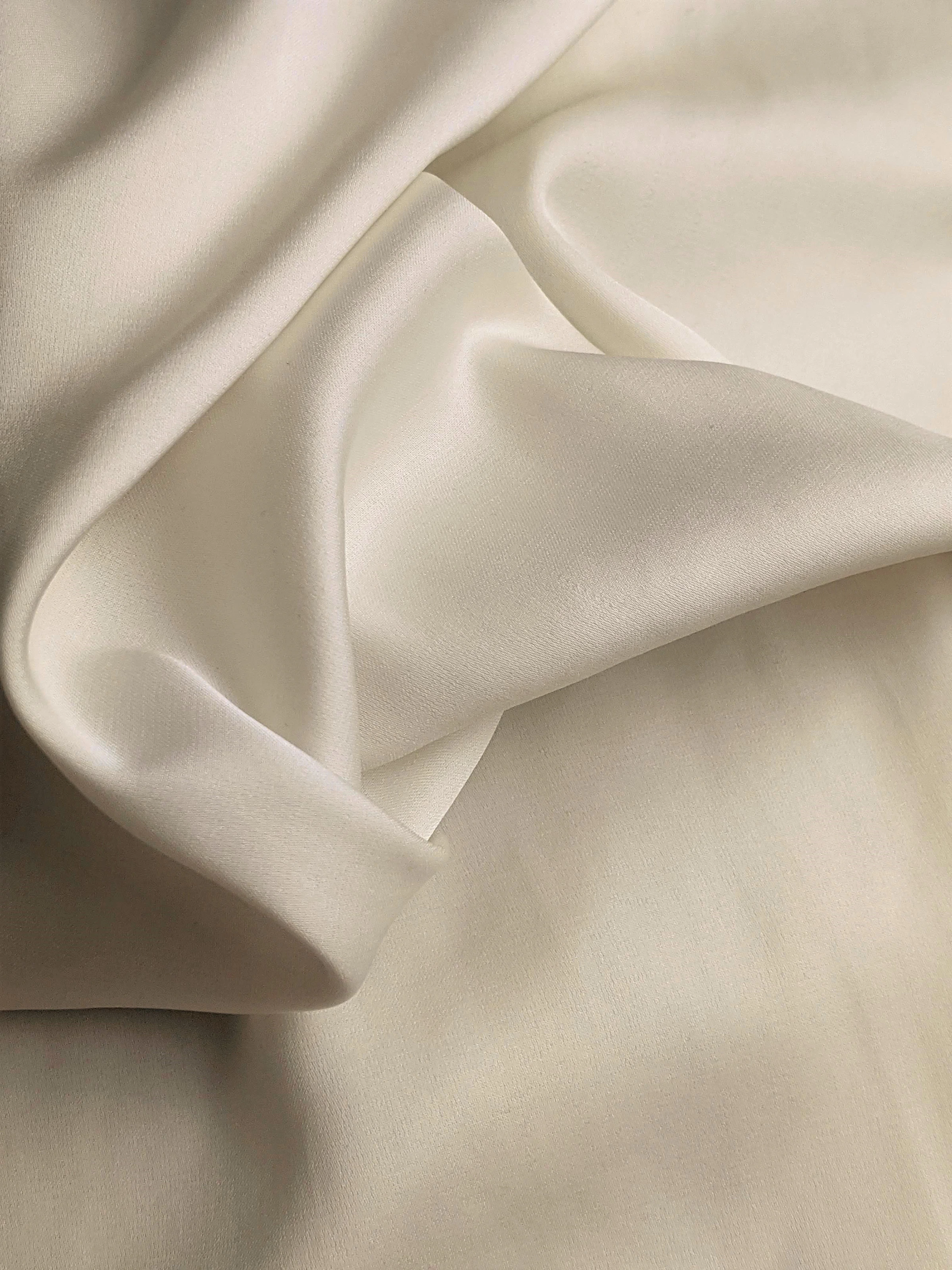 Ivory silk folds photographed in soft light