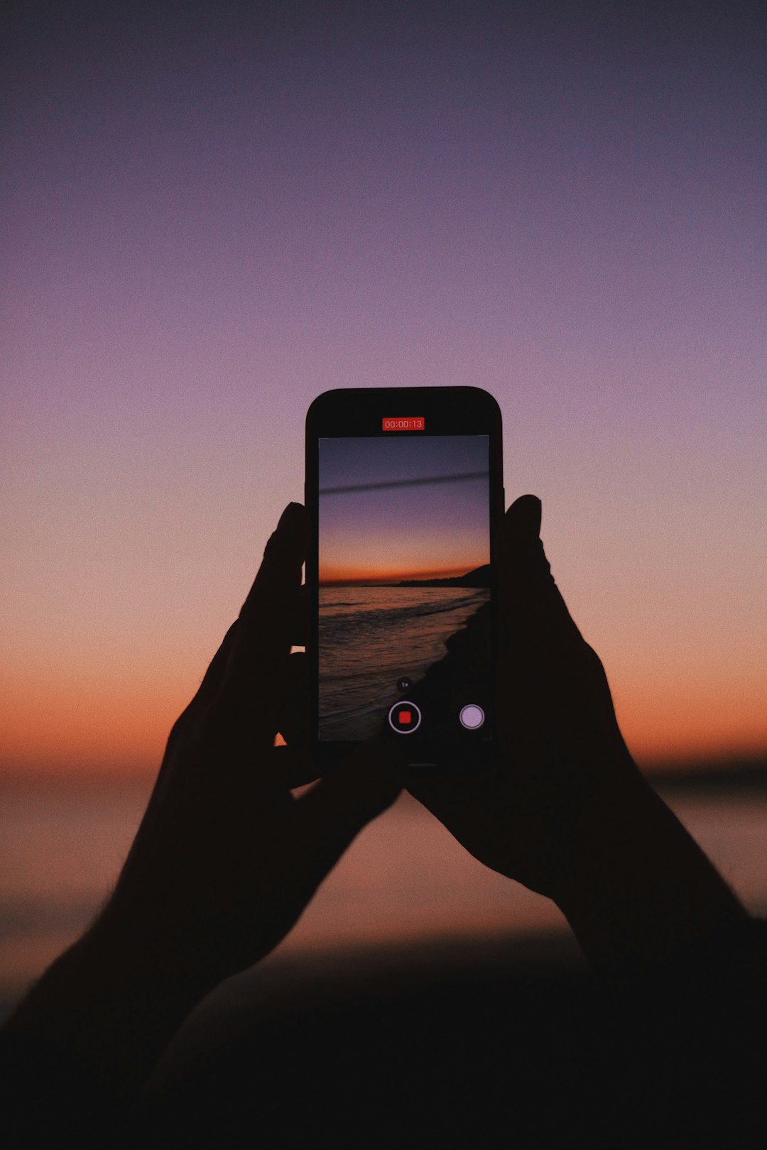 person holding black iphone 5