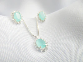 A charming kids' jewellery set featuring a ring and necklace with playful designs displayed on a white surface