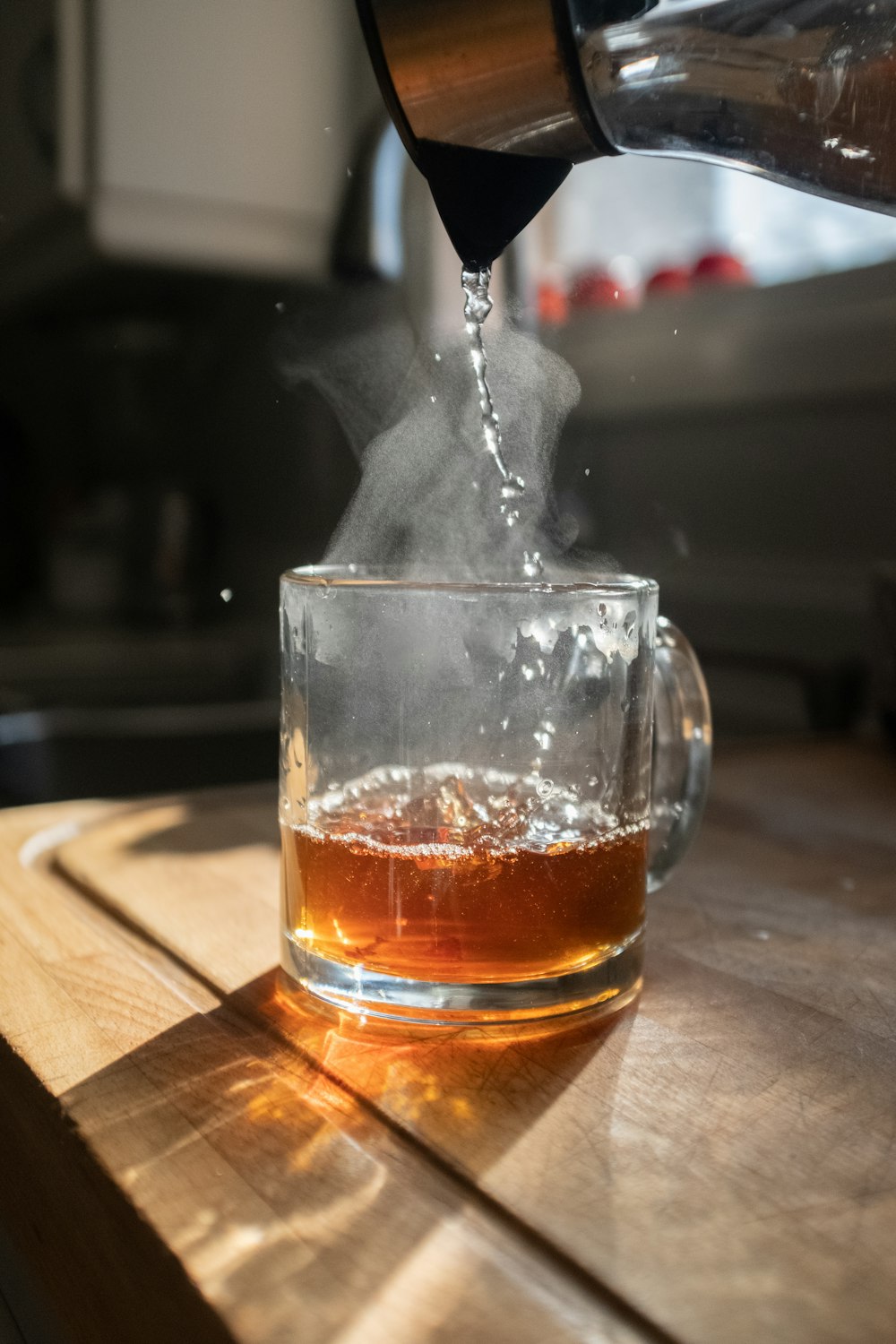 clear drinking glass with brown liquid