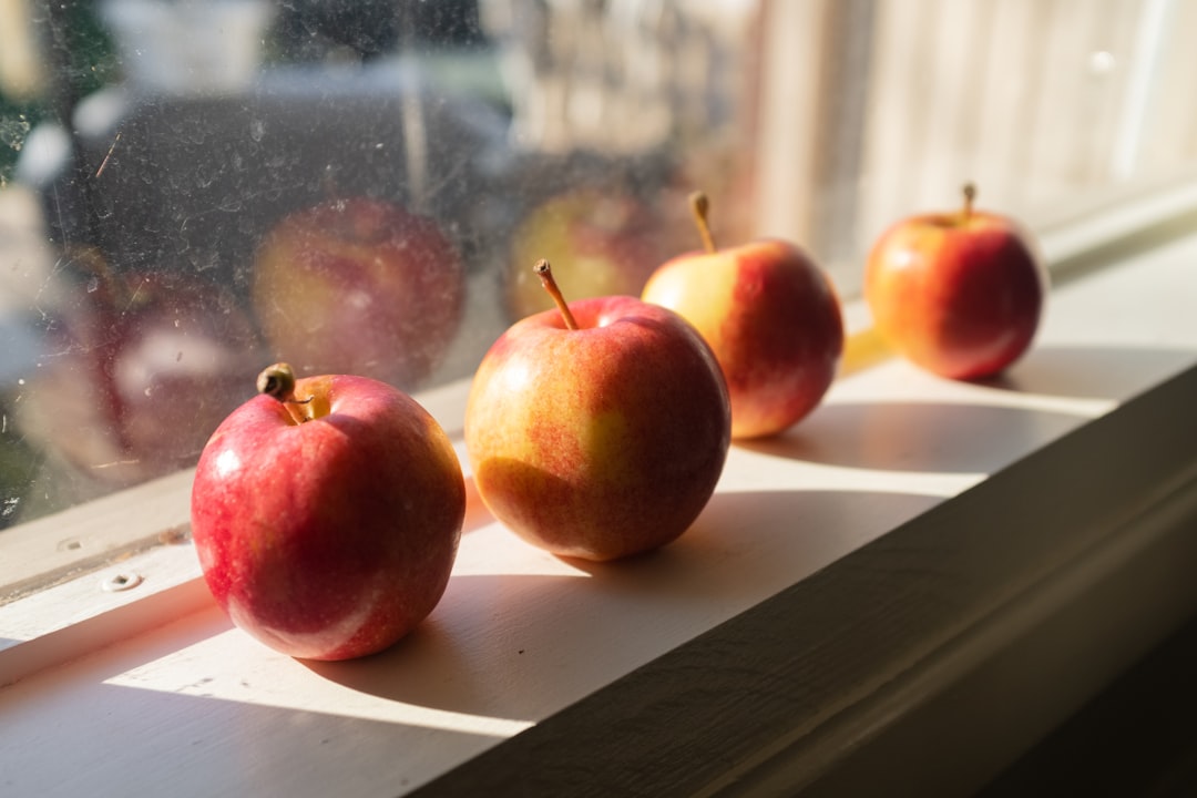 red apples on white wooden table