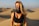 A smiling woman enjoying the desert scenery at Farafra.