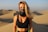 A smiling woman enjoying the desert scenery at Farafra.