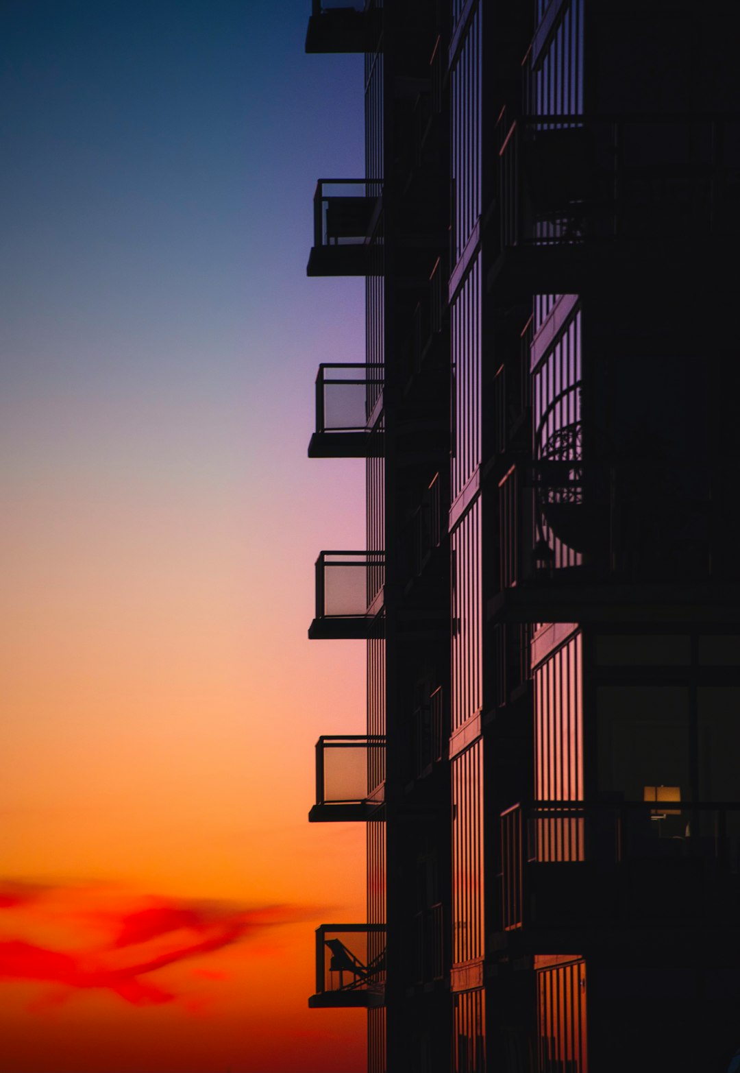 silhouette of a building during sunset