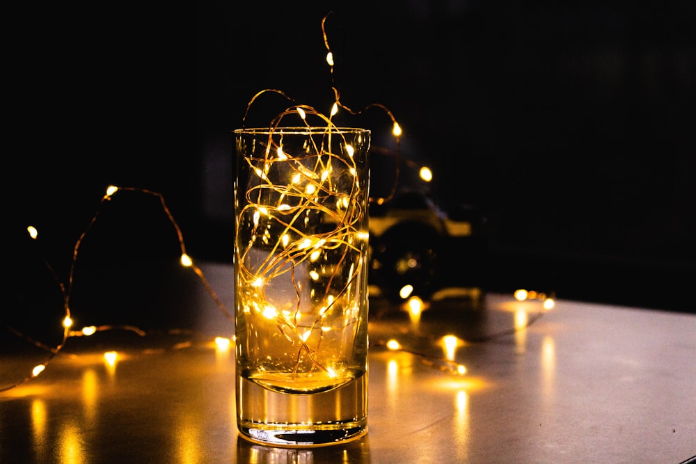 clear glass cup with yellow liquid