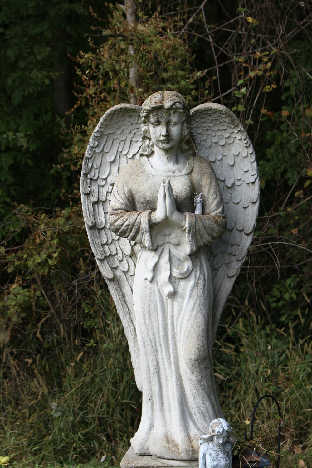 angel statue on green grass