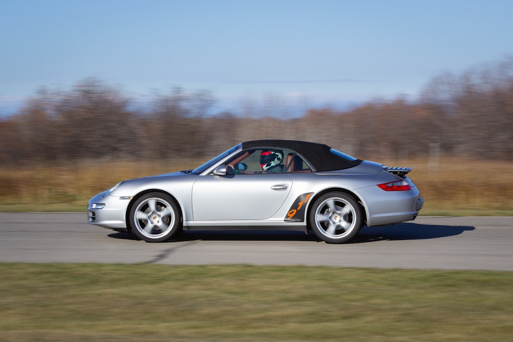 silver porsche 911 on road during daytime