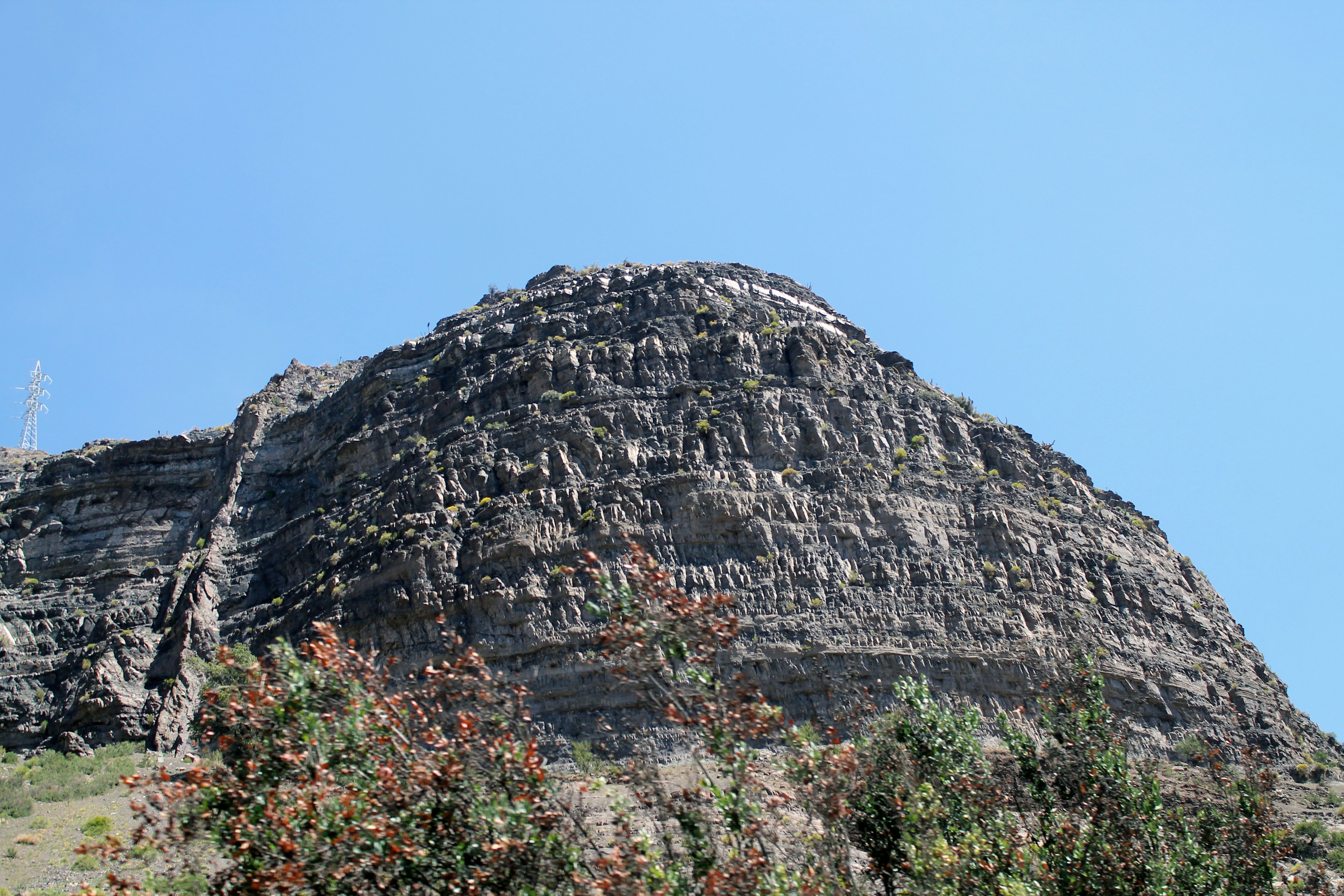 gray rocky mountain under blue sky during daytime