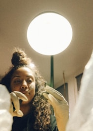 Close-up of technician preparing precise hair follicle extraction tools