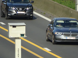 Fleet vehicle equipped with multiple security cameras on a highway.