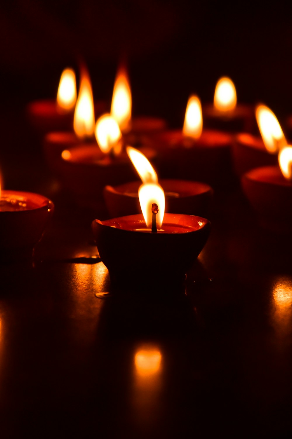 red candles on brown wooden table