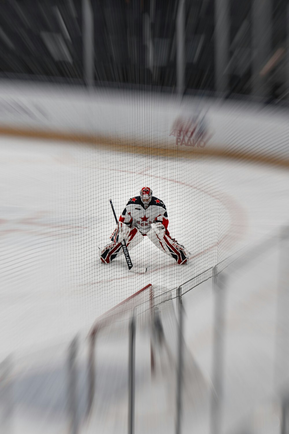 man in white and red jacket riding on white and red hockey board