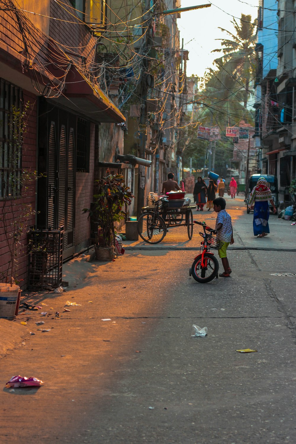 red and black bicycle on sidewalk during daytime