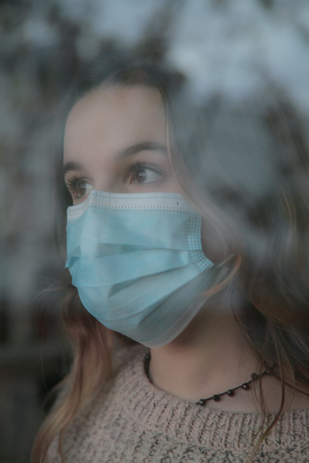 woman wearing white face mask