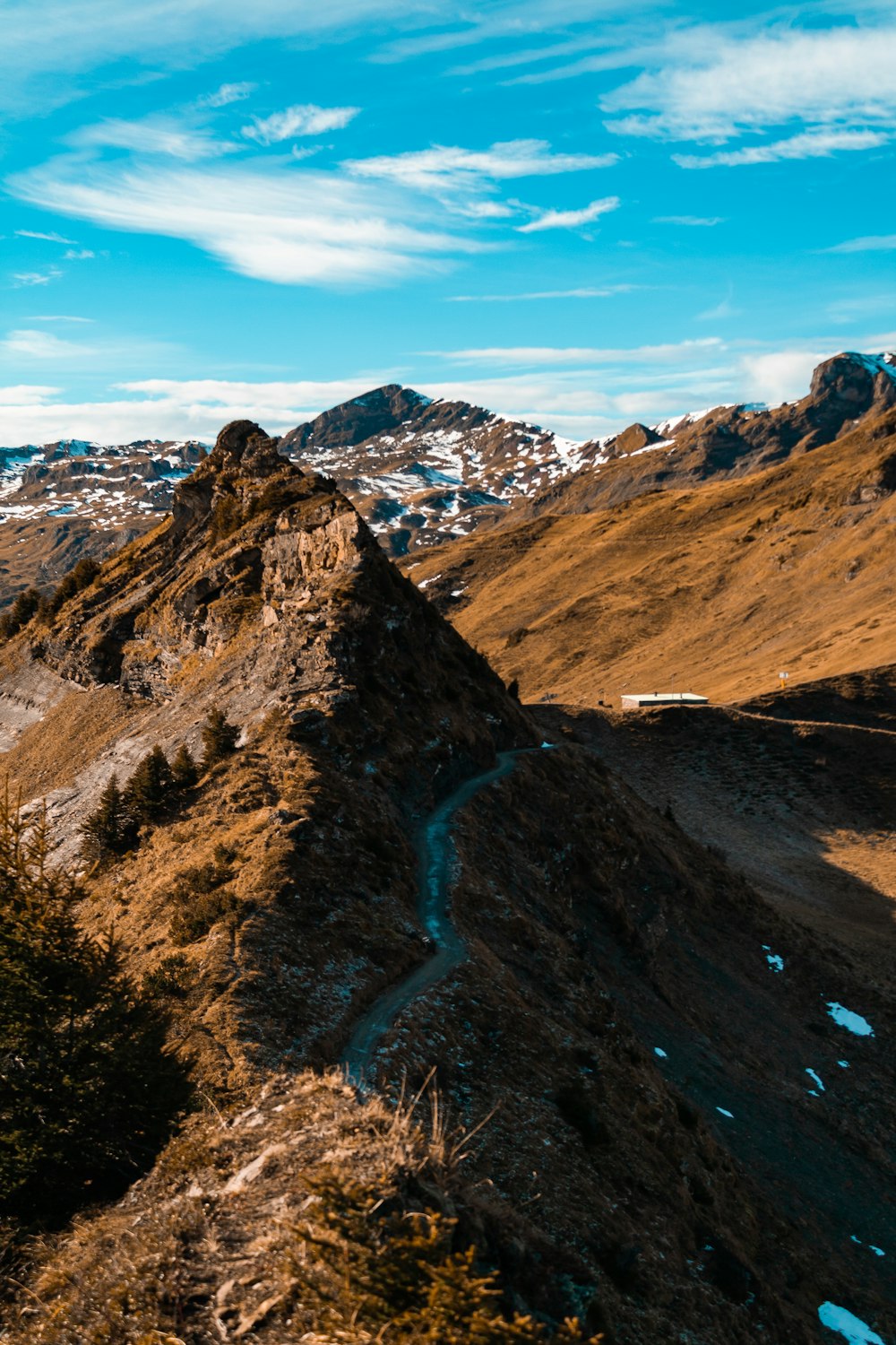 brown and white mountains under blue sky during daytime