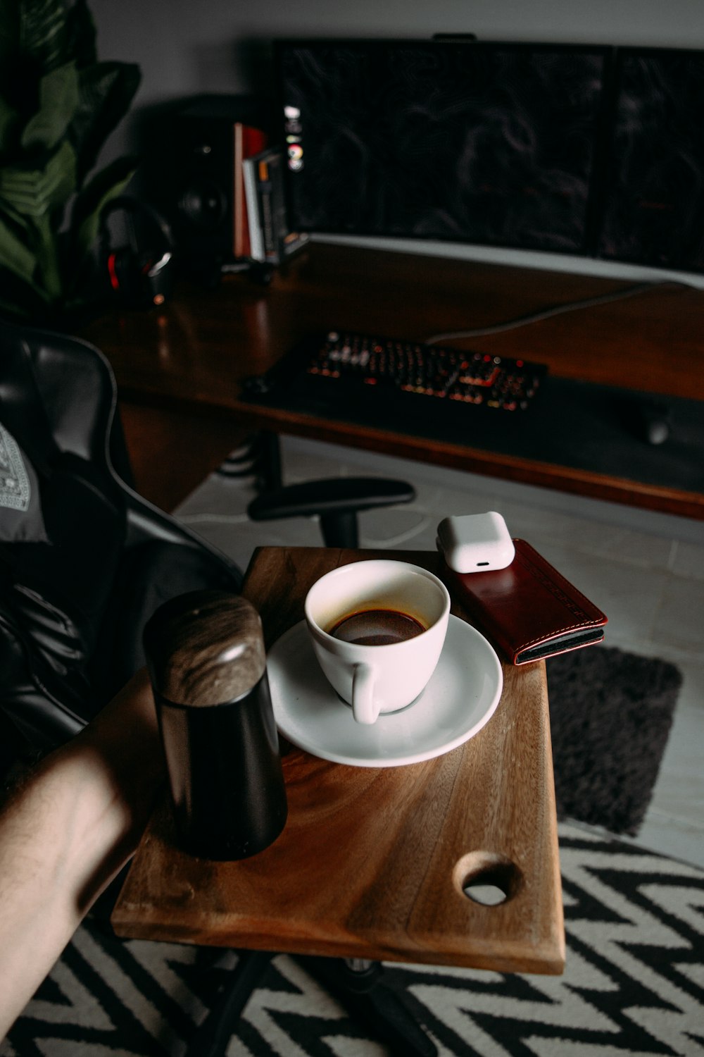 white ceramic teacup on brown wooden table