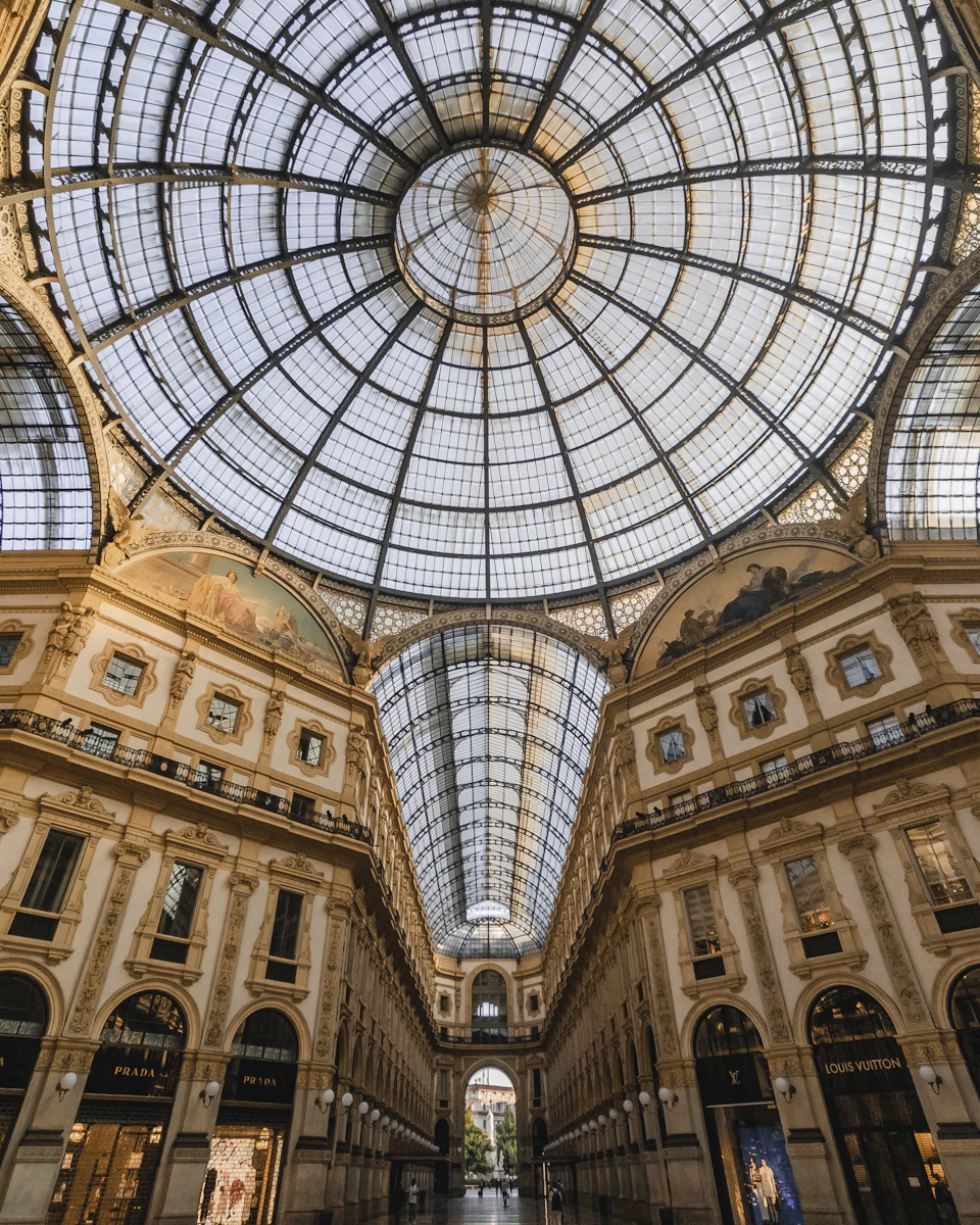 Ornate glass dome supported by two columns atop a multi-level building structure