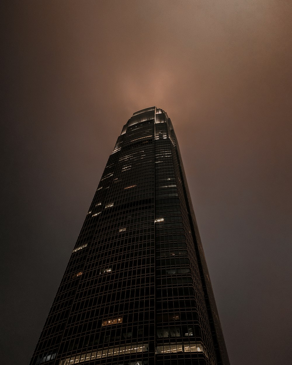 black high rise building during night time